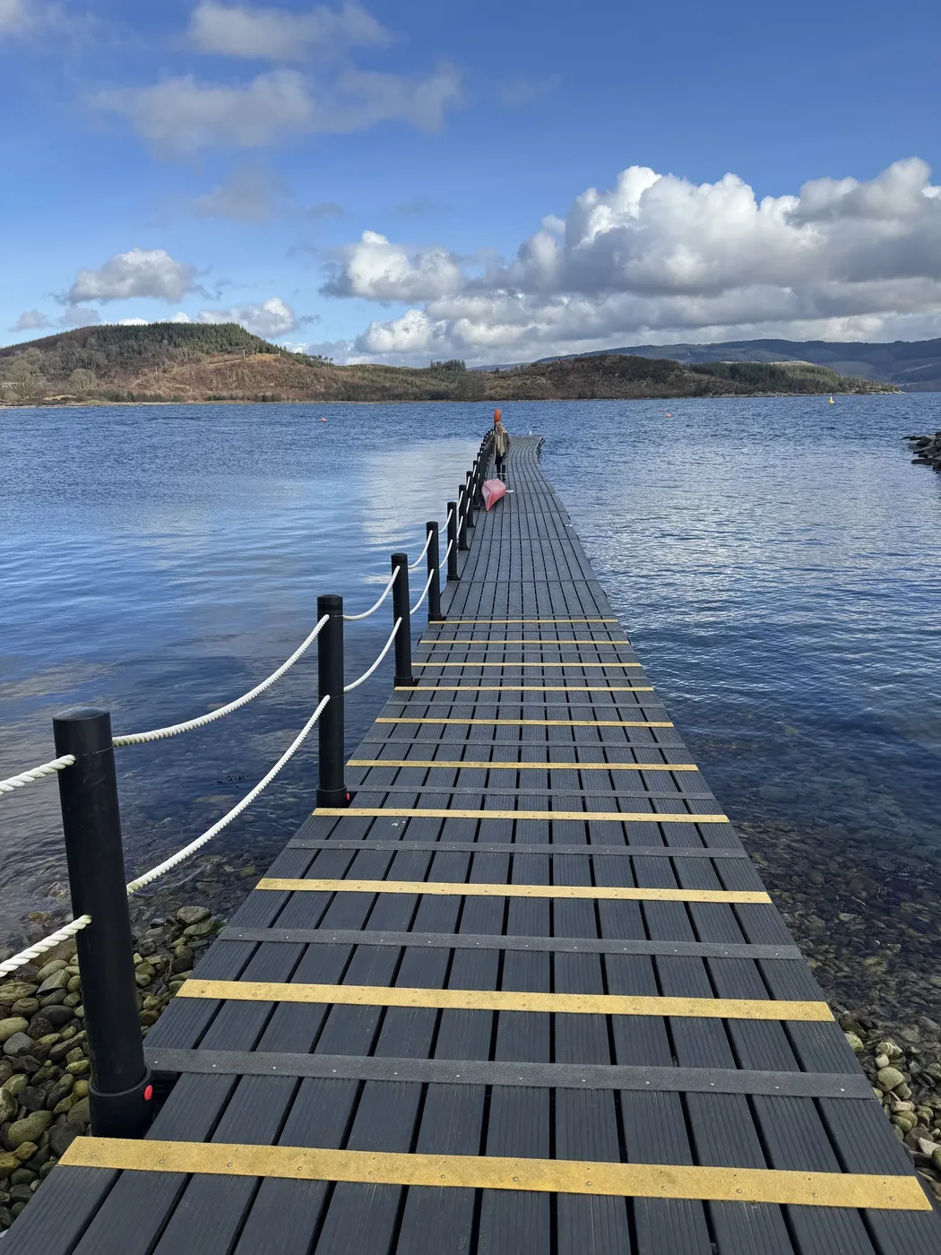 Wooden jetty stretching into Loch Fyne