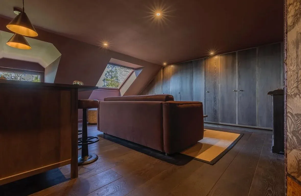 Warm attic lounge with soft lighting